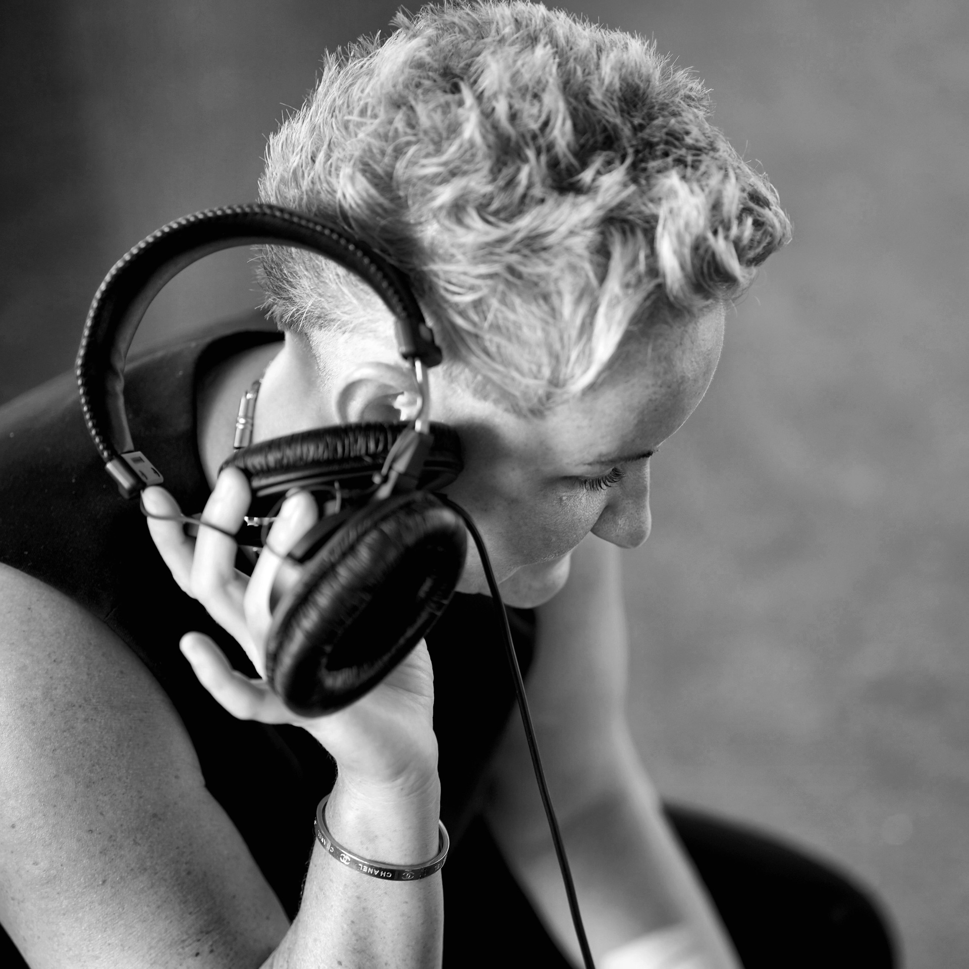 Artist in the studio wearing headphones