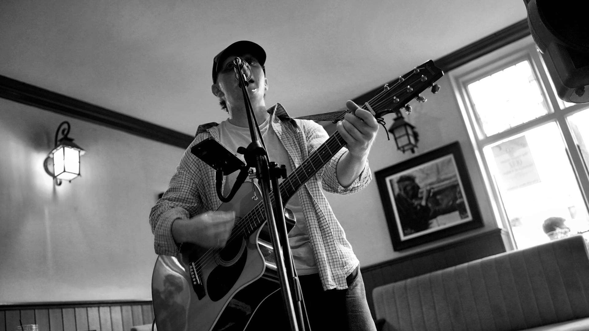 Singer-guitarist performing in a local pub